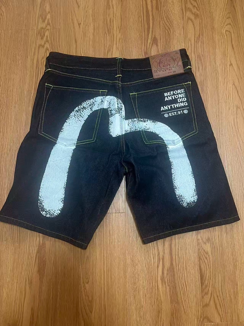Evisu Black Denim Shorts with White Back Graphic